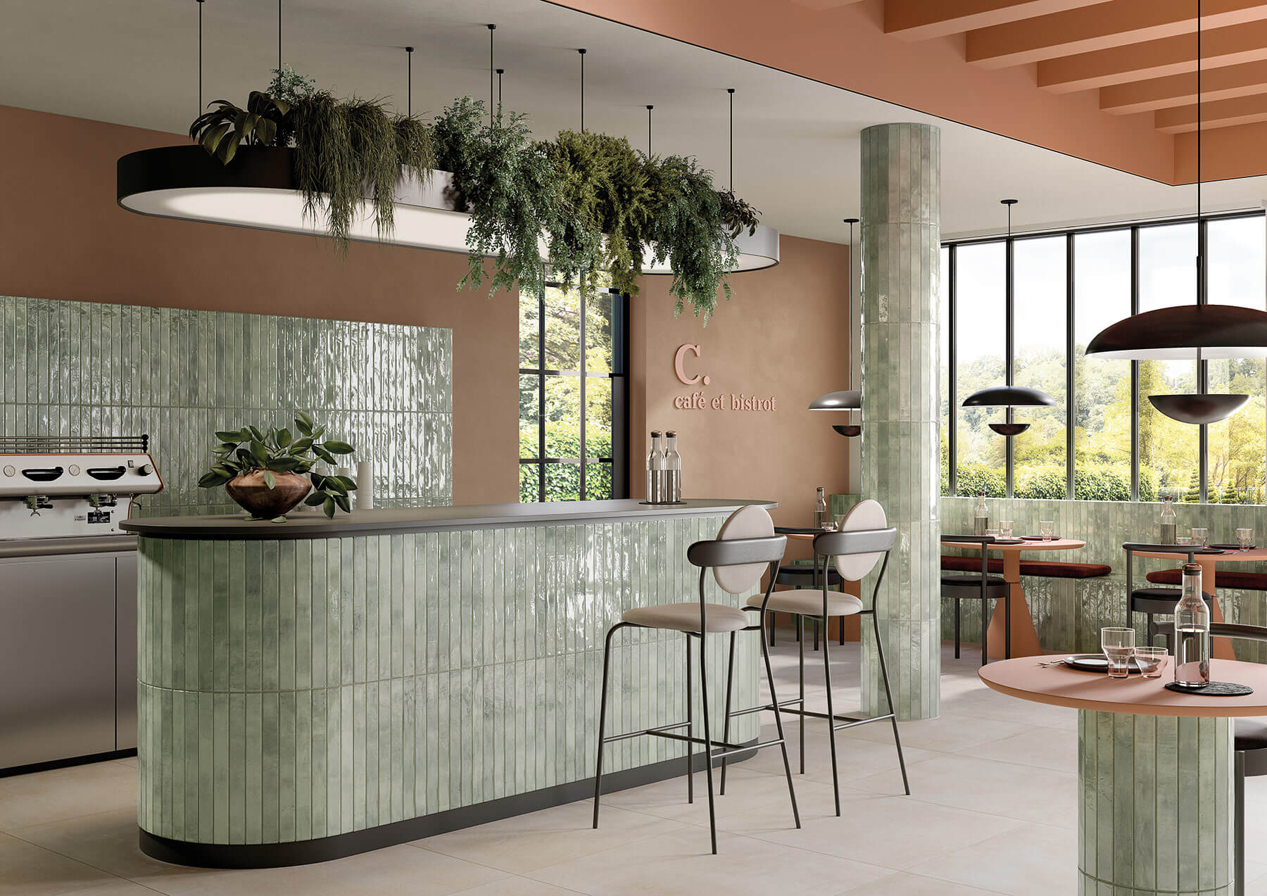 Contemporary cafe concept with curved cabinets, bar and tables all covered in glossy green subway tiles laid vertically.