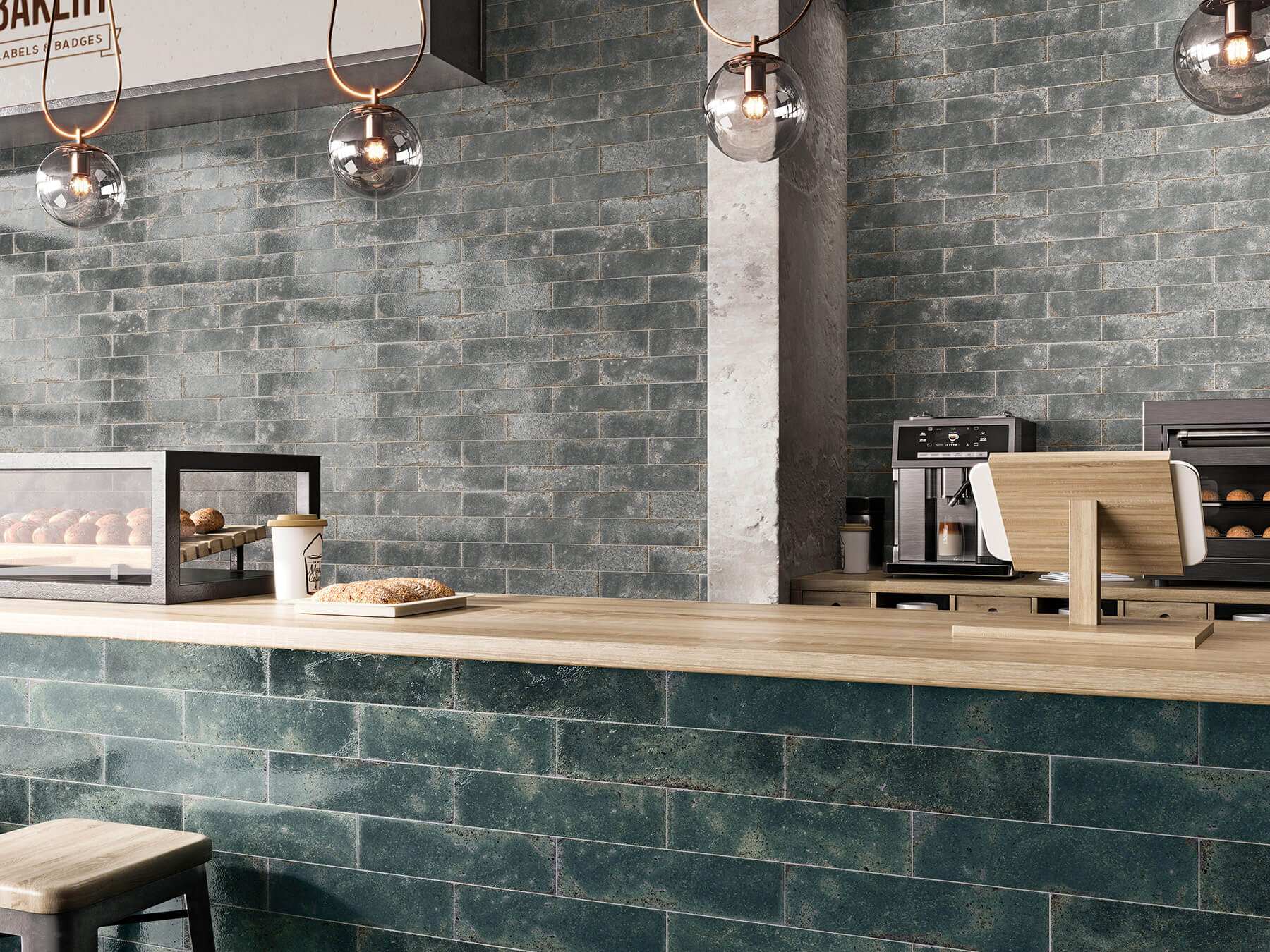 Cafe interior with feature grey tile wall and jade green tile counter front.