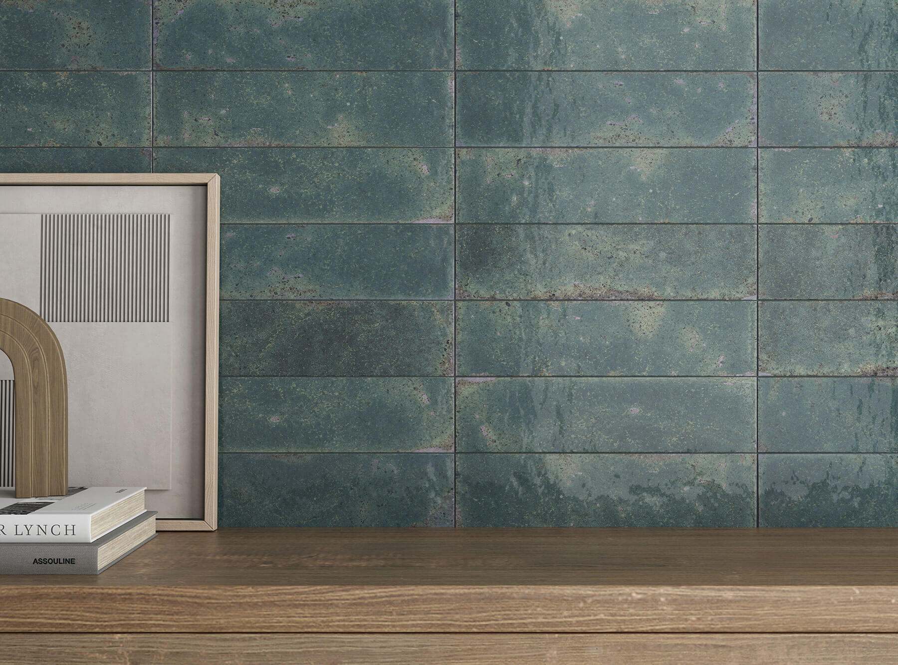Close up of feature subway tile wall in deep jade green.