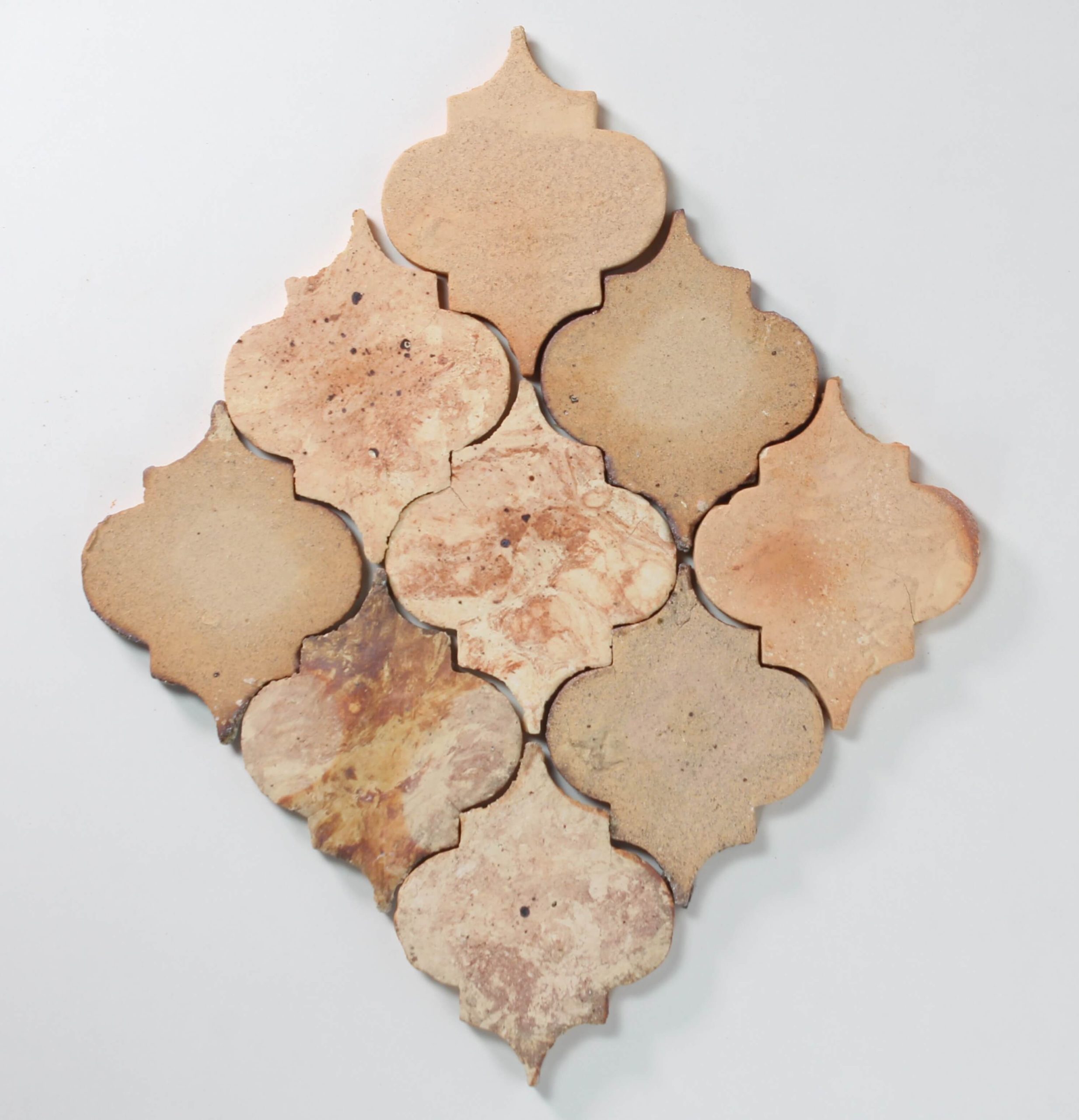 Close up of stone colour tiles on white background