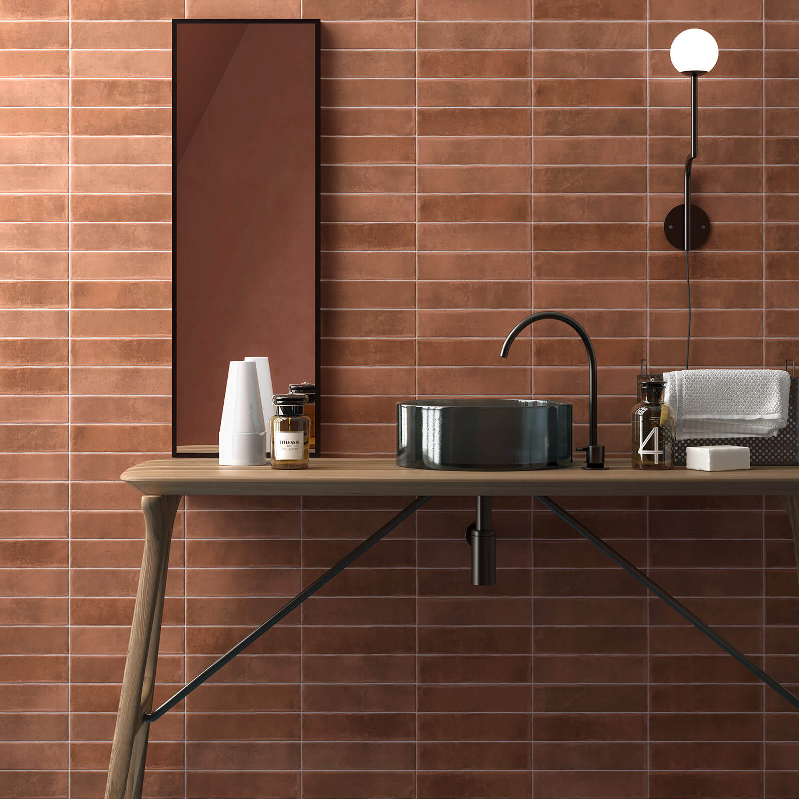 Modern bathroom wall showing timber table, black sink and brown subway tiles.