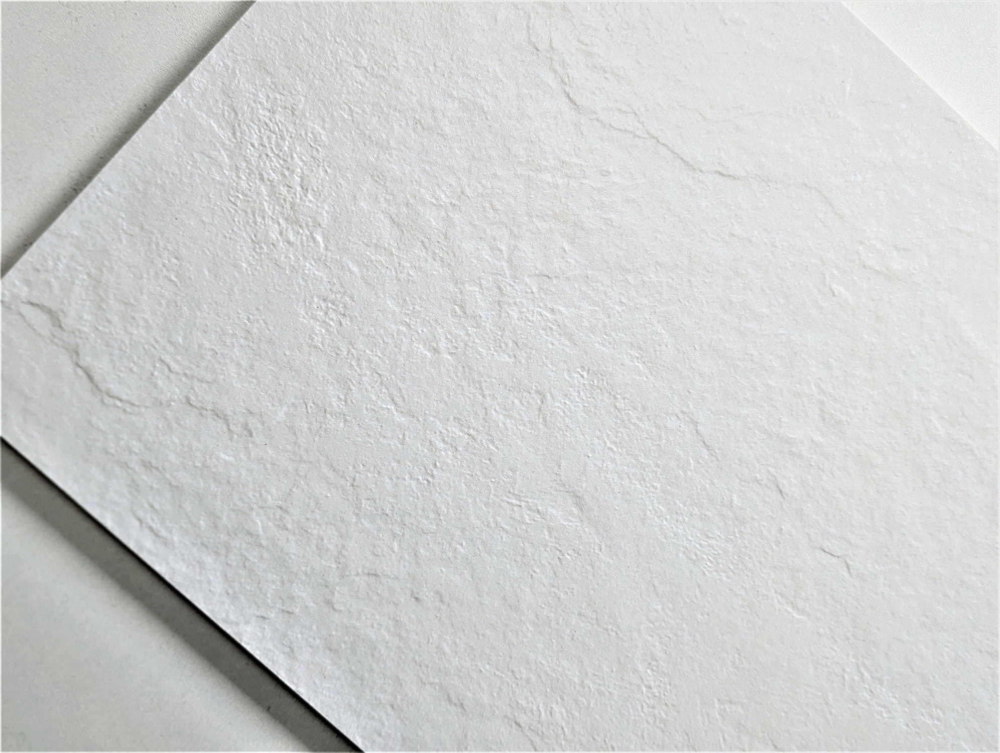 Close up of white tiles with texture surface.