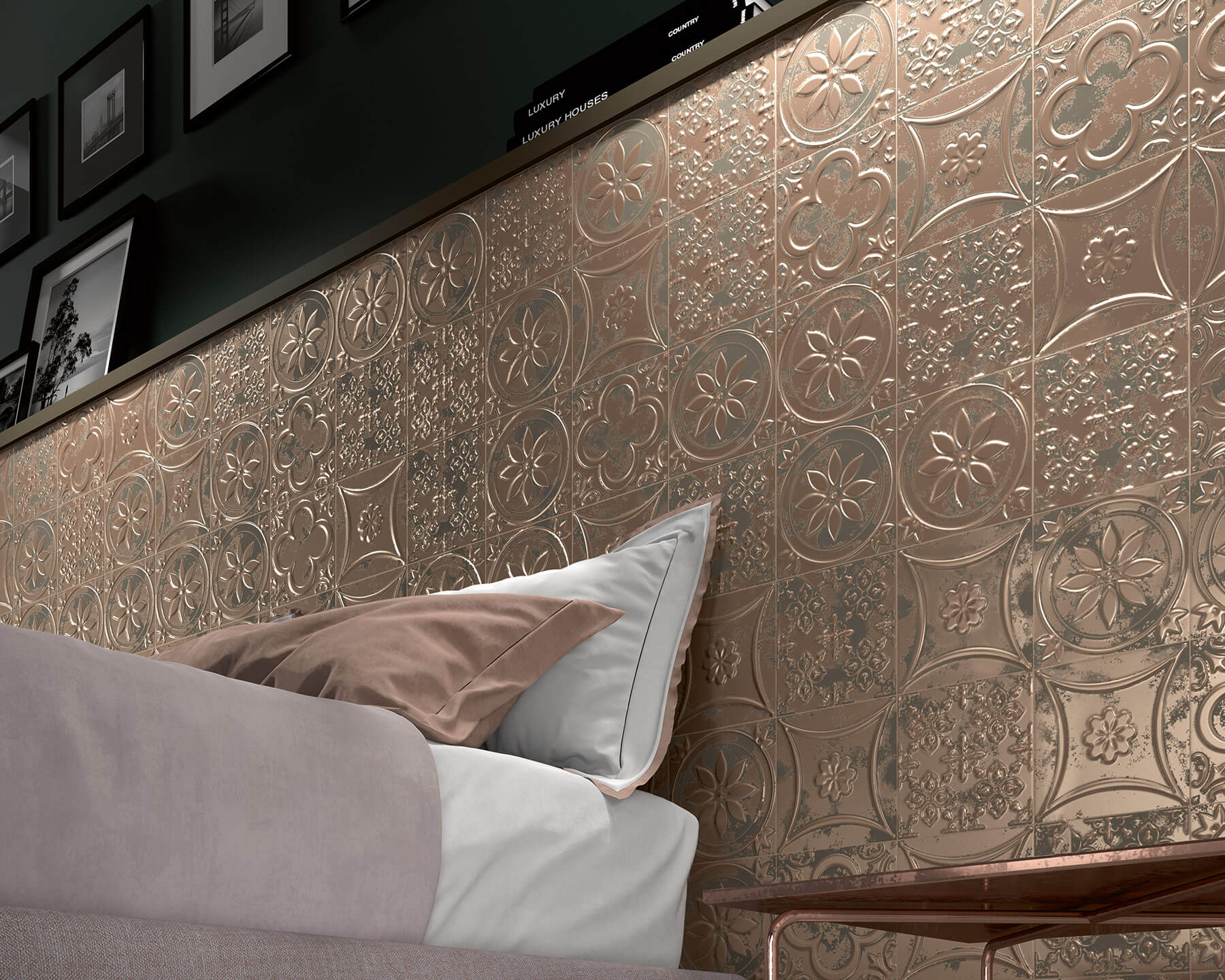 Close up of feature wall of tiles behind a bed. The tiles look like pressed tin and have a bronze, rustic metallic finish.