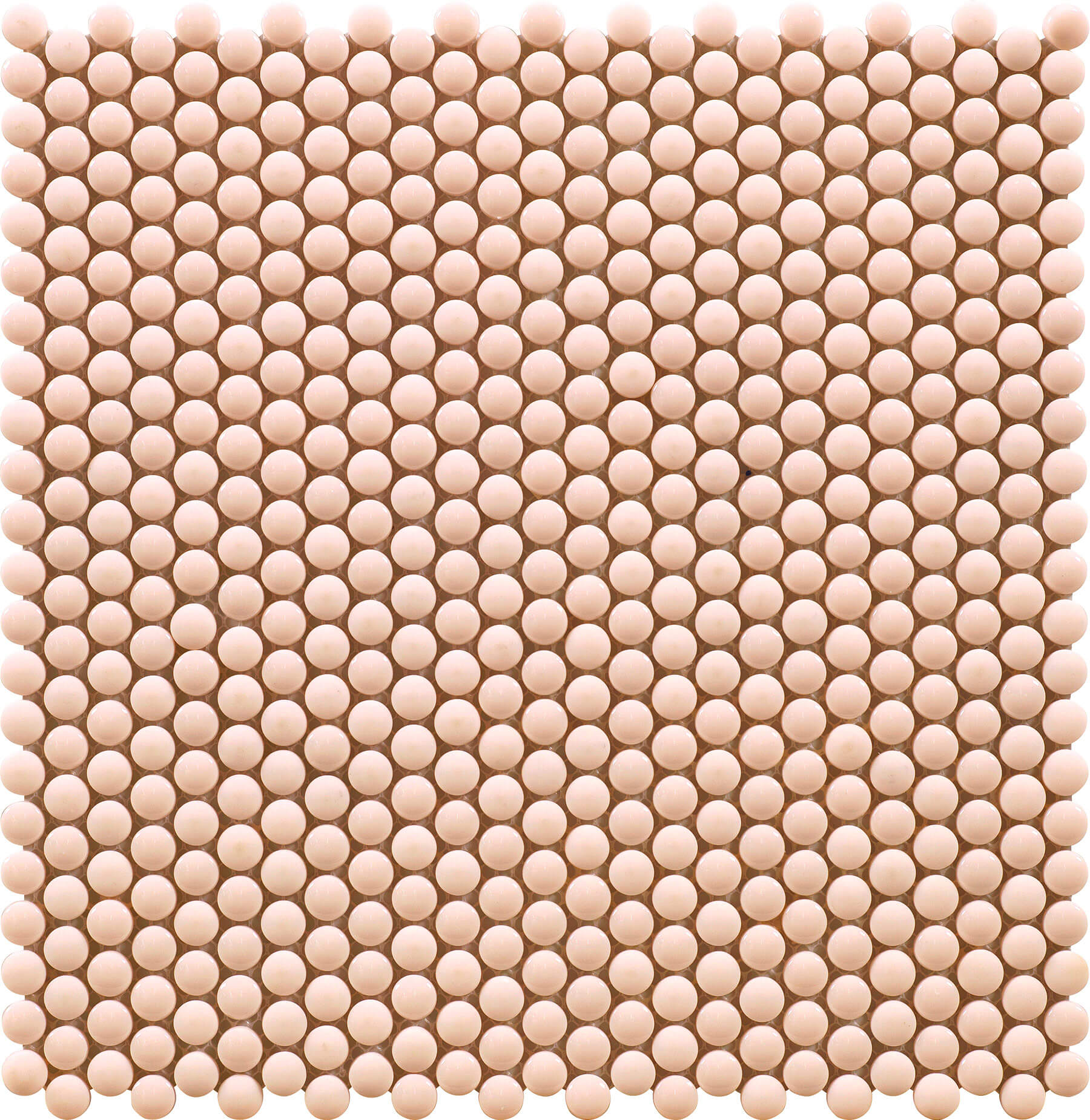 Close up of soft pink round mosaic tiles.