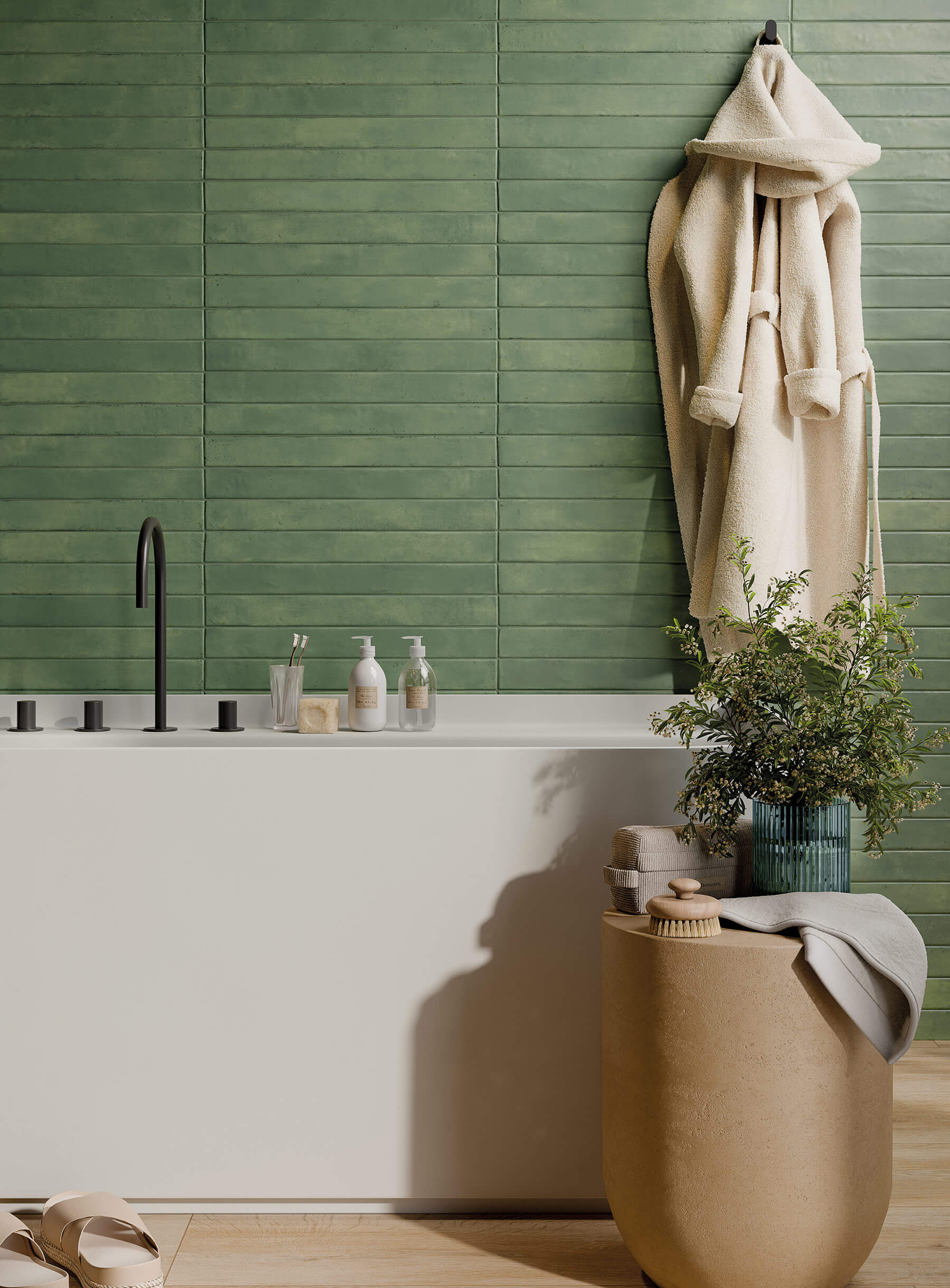 Close up of bathroom with large white soaker tub and feature wall of long green subway tiles laid horizontally.