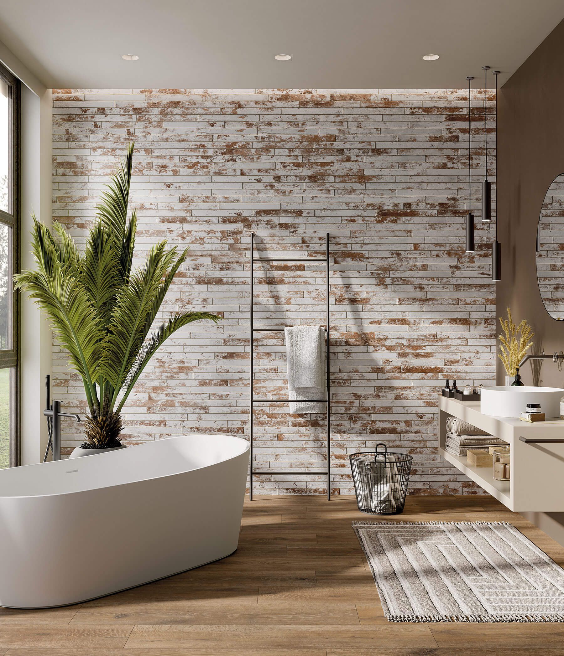 Concept bathroom with white tub and vanity, timber floor and feature wall of rustic subway tiles that are mostly white but have patches of brown so it looks like a brown brick wall roughly painted white