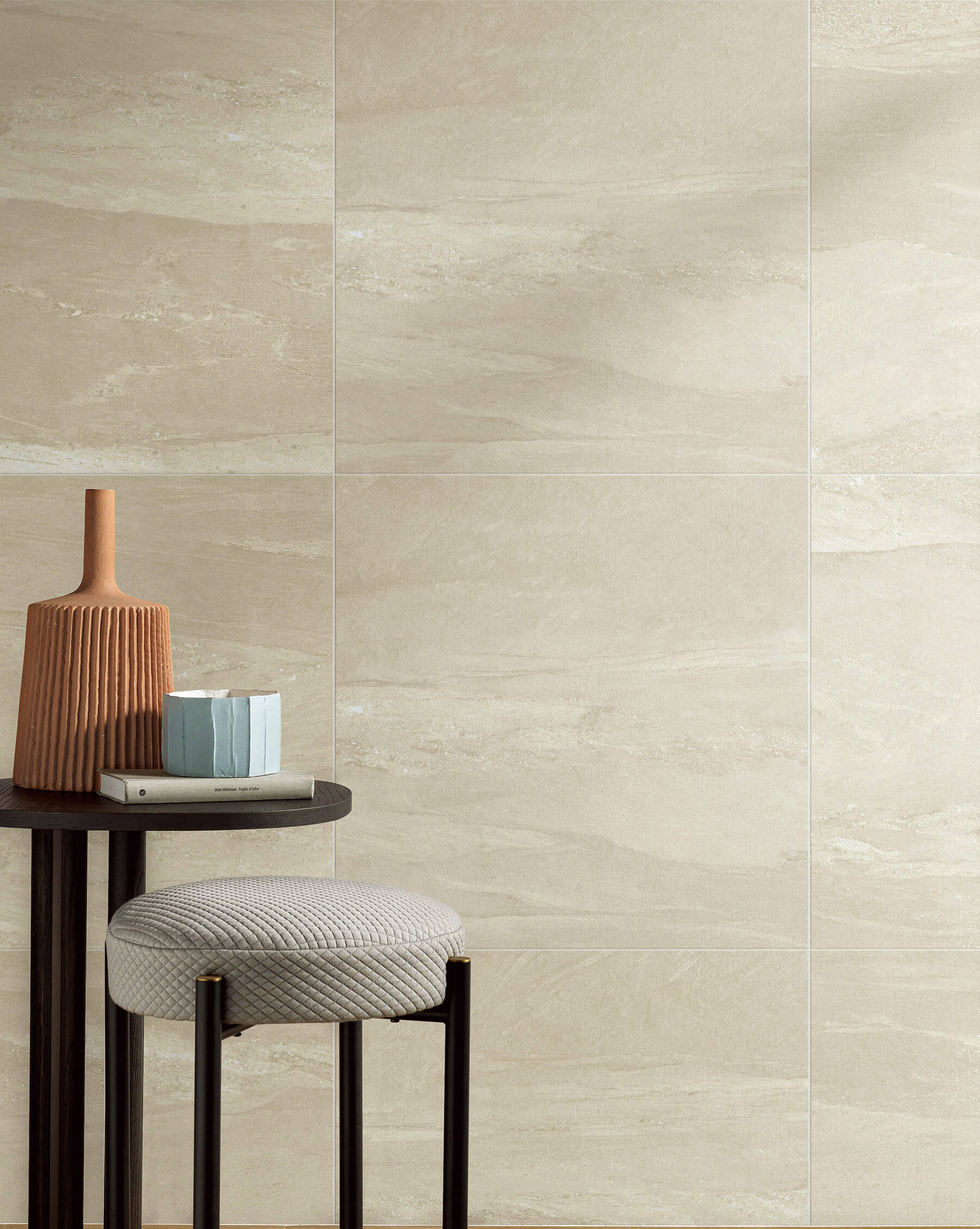 Feature wall of sandstone looking large square tiles.