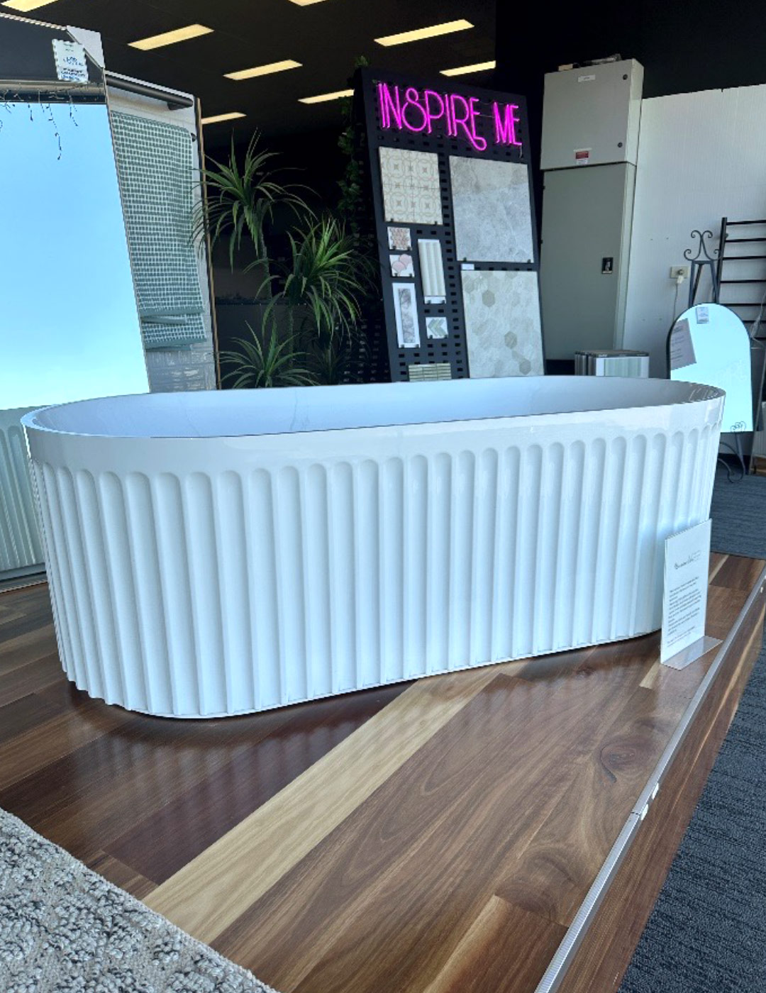Modern White bathtub on display in a store.