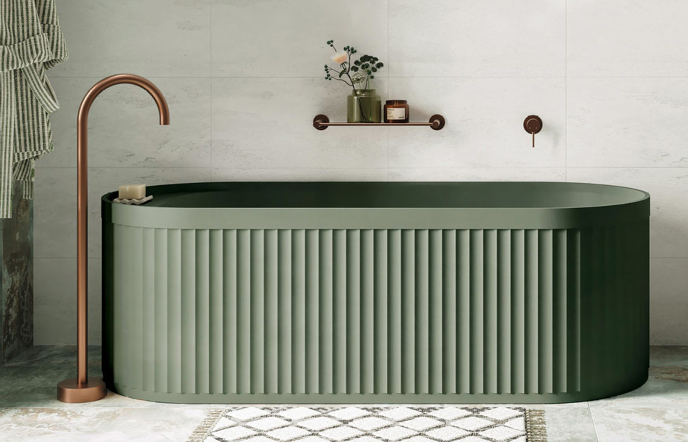 Luxury bathroom with modern sage green bathtub with copper colour tapware.