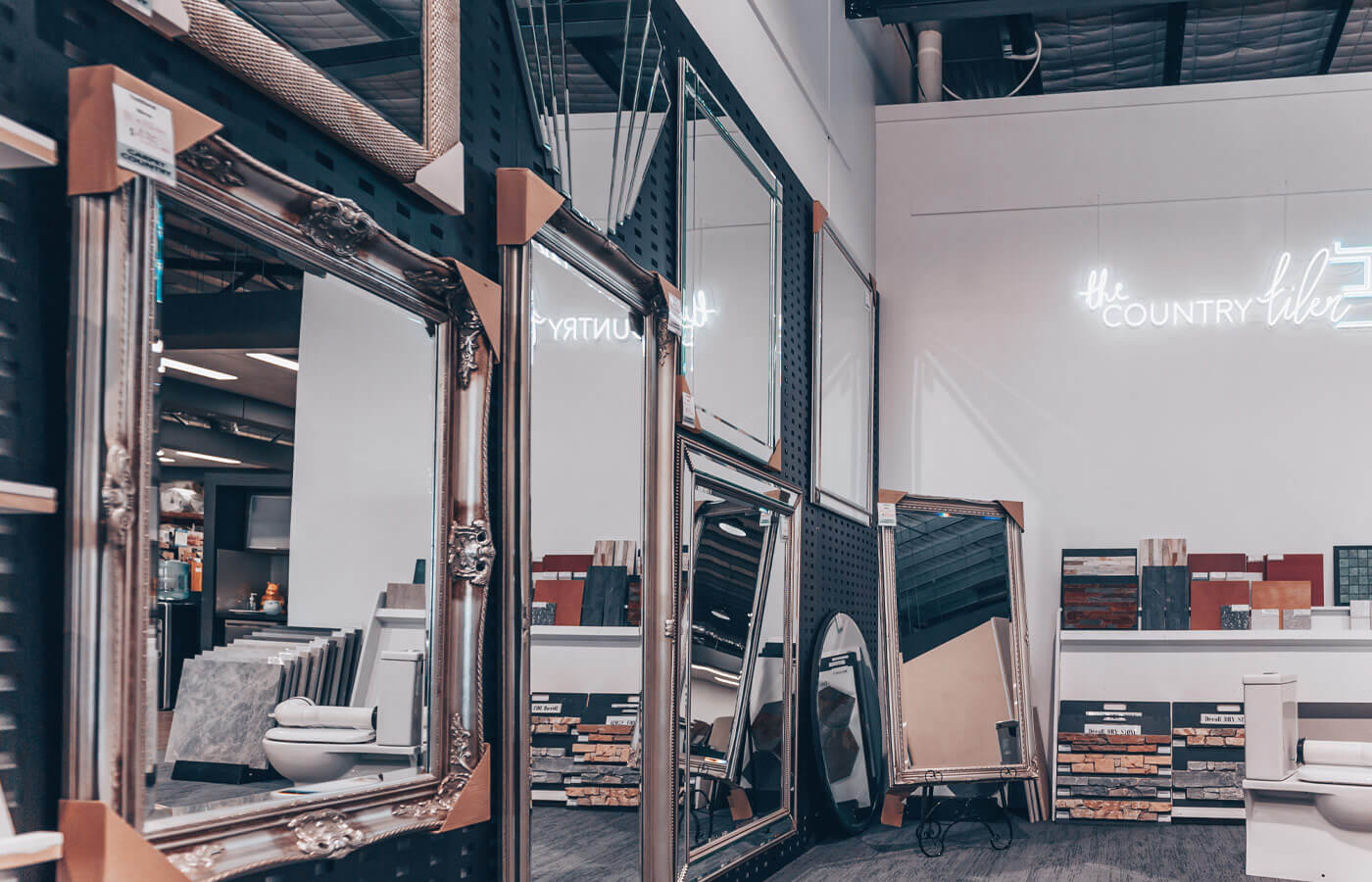 Selection of mirrors on display with various frames and styles.