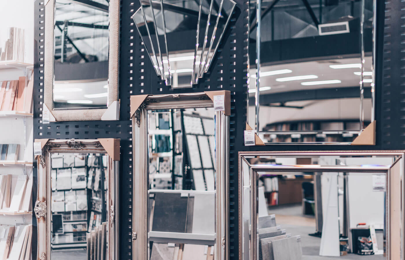 Selection of mirrors on display with various frames and styles.