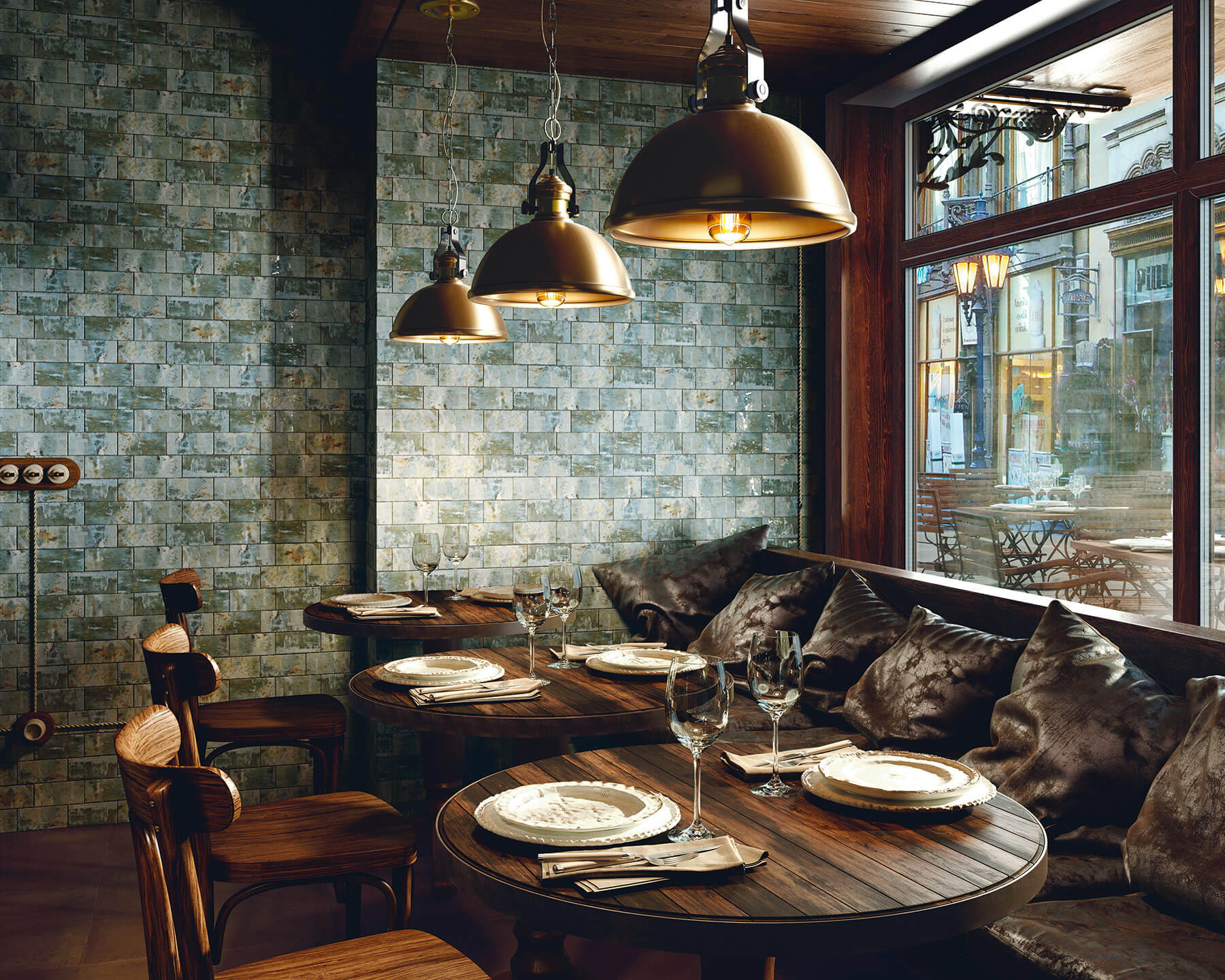 Cafe interior that looks dark a cosy. Feature wall of green subway tiles.